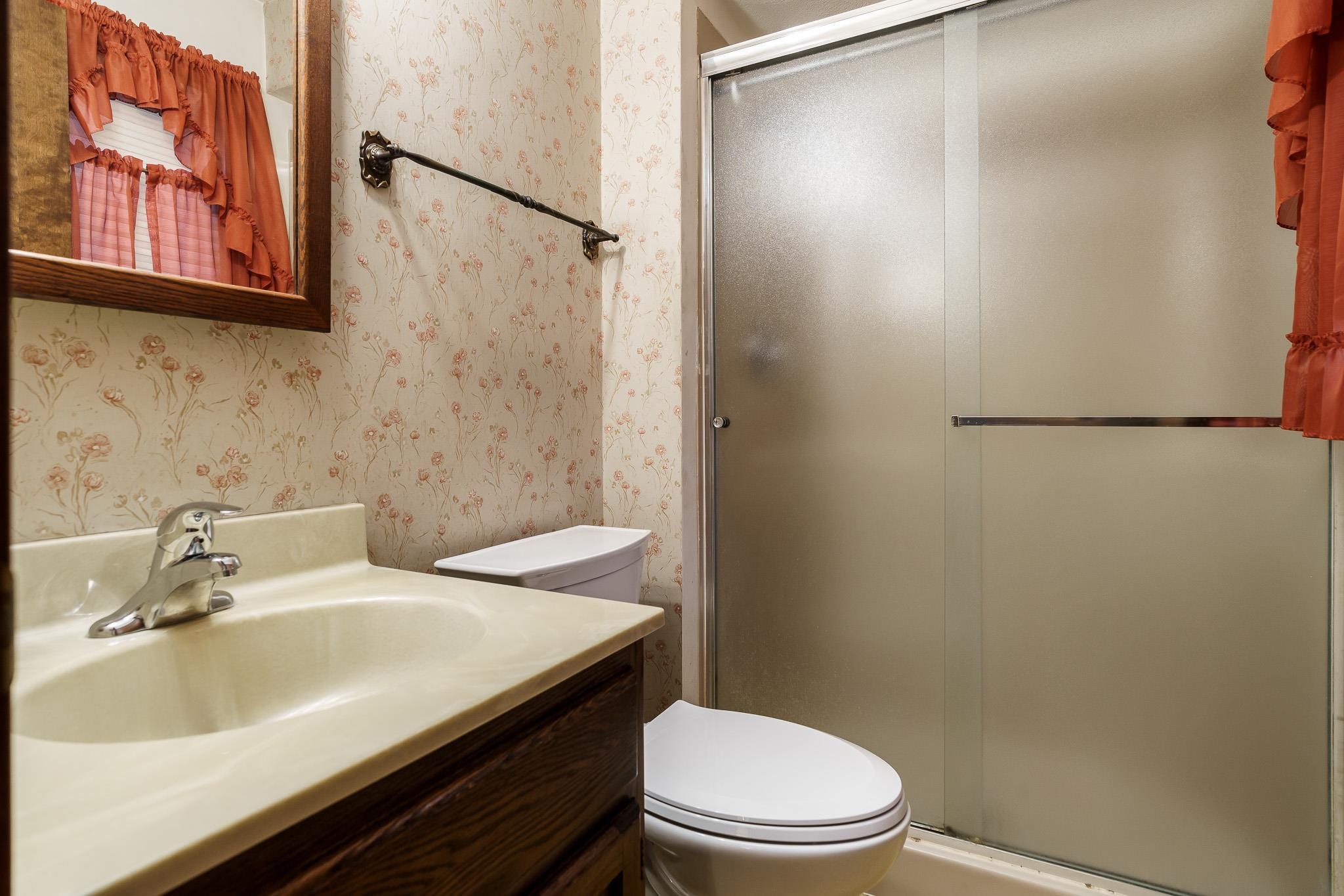6644 Belvidere Road Roscoe, IL 61073 - Photo 35 of 42 a bathroom with a sink toilet and shower
