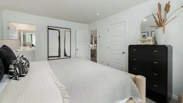 a bedroom with a bed and a dresser