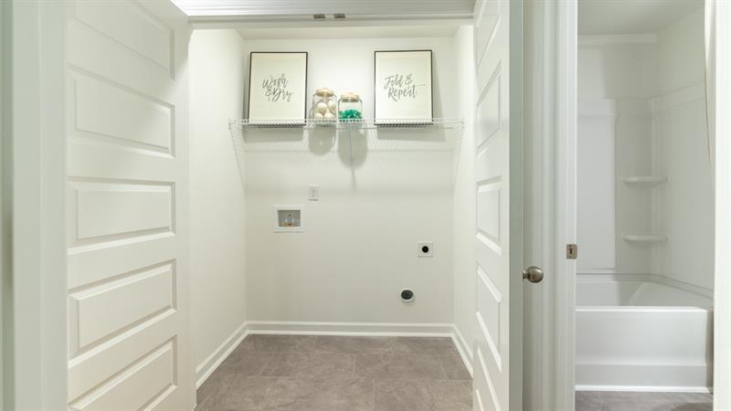1392 Sweetshrub Place, Unit 1392 Austell, GA 30168 - Photo 28 of 28 a bathroom with a glass shower door
