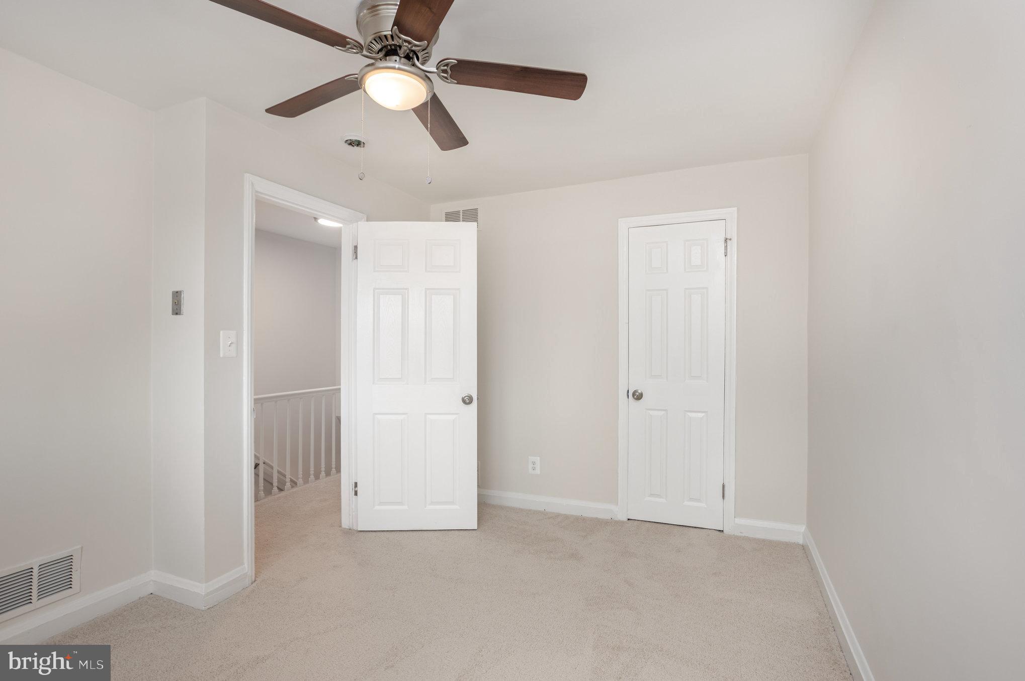 53 South Hawthorne Road Middle River, MD 21220 - Photo 17 of 29 an empty room with closet and a chandelier fan