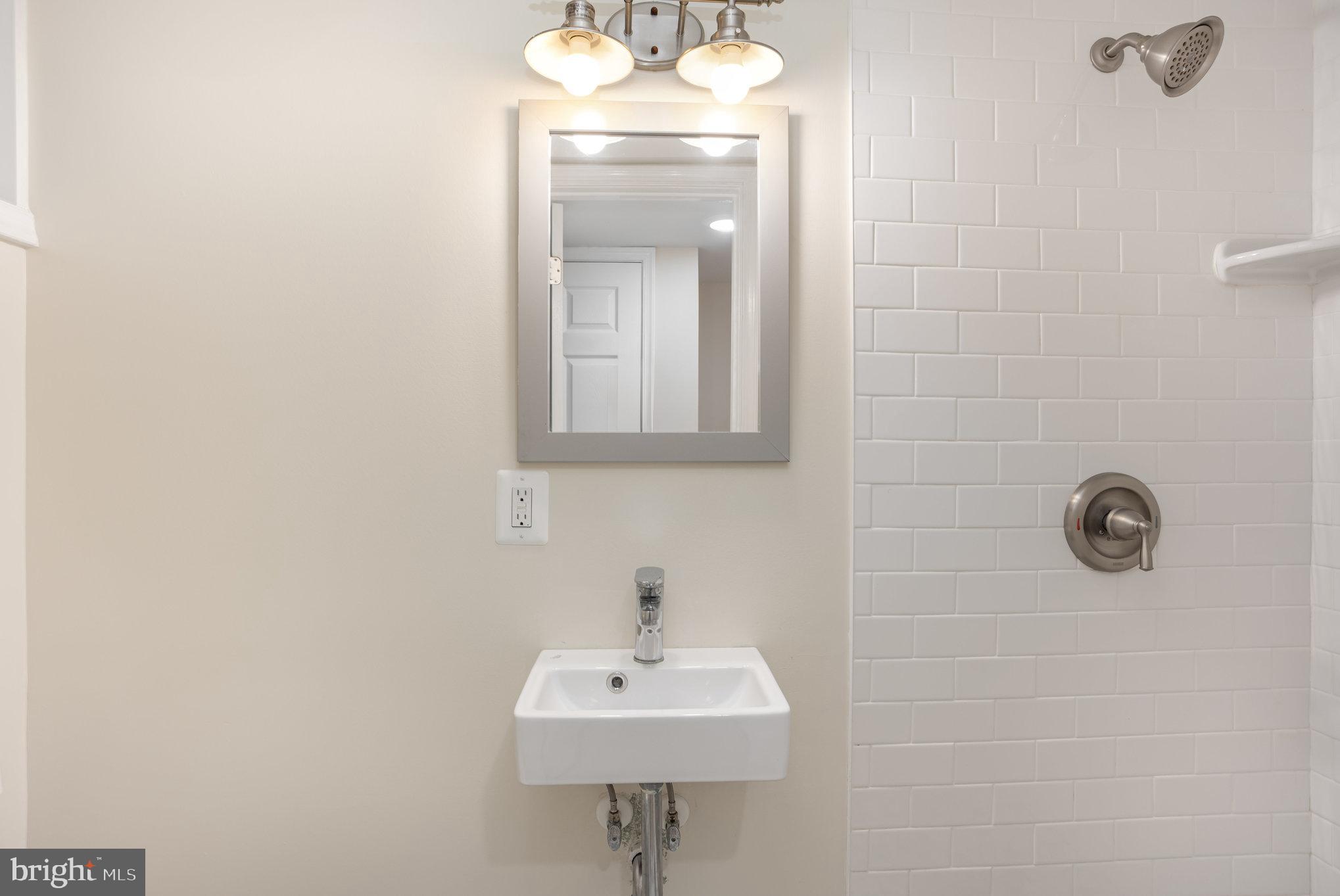 53 South Hawthorne Road Middle River, MD 21220 - Photo 23 of 29 a bathroom with a sink a mirror and a toilet