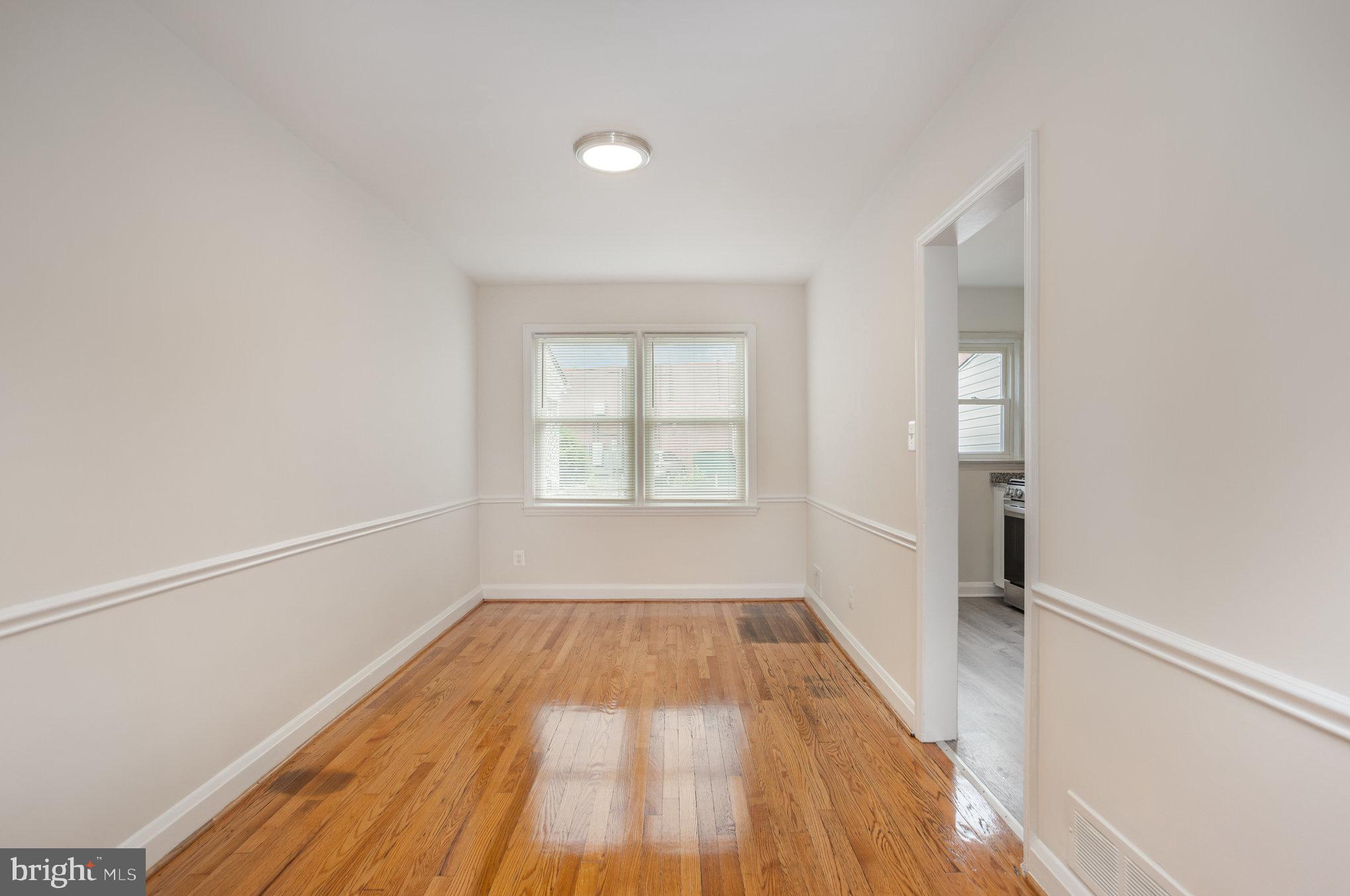 53 South Hawthorne Road Middle River, MD 21220 - Photo 7 of 29 a view of a room with wooden floor and window