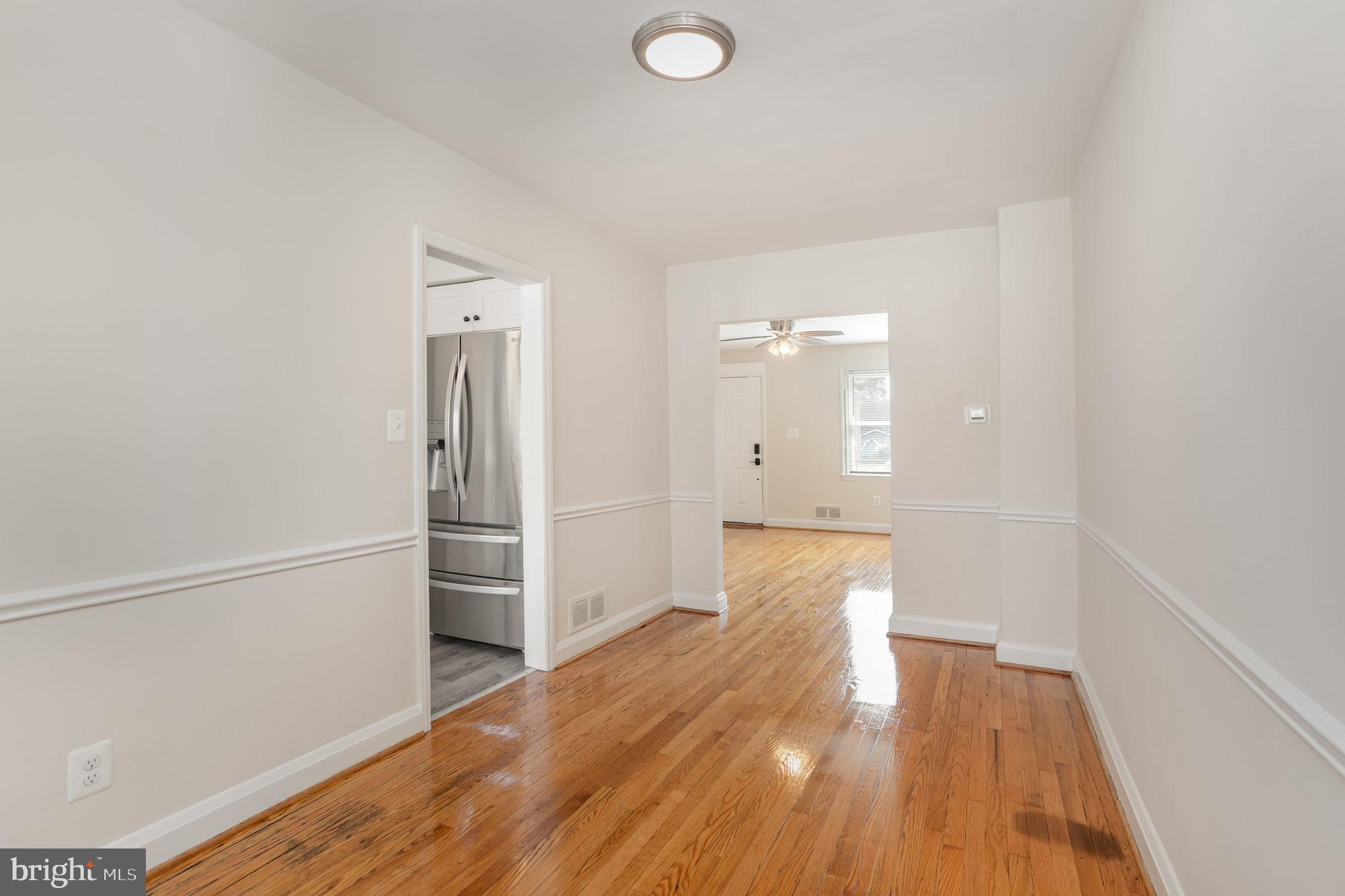 53 South Hawthorne Road Middle River, MD 21220 - Photo 9 of 29 a view of a hallway with wooden floor and closet