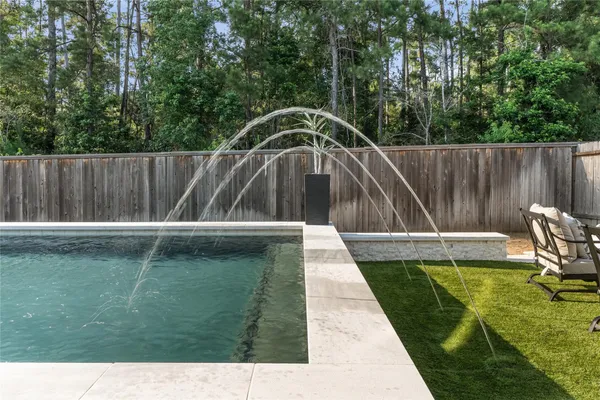a view of swimming pool with a back yard