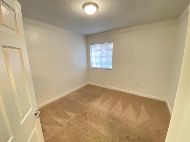 4105 Napoli Lake Drive Riviera Beach, FL 33410 - Photo 8 of 14 an empty room with a window