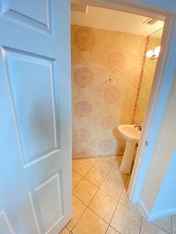 4105 Napoli Lake Drive Riviera Beach, FL 33410 - Photo 10 of 14 a bathroom with a granite countertop shower and a toilet
