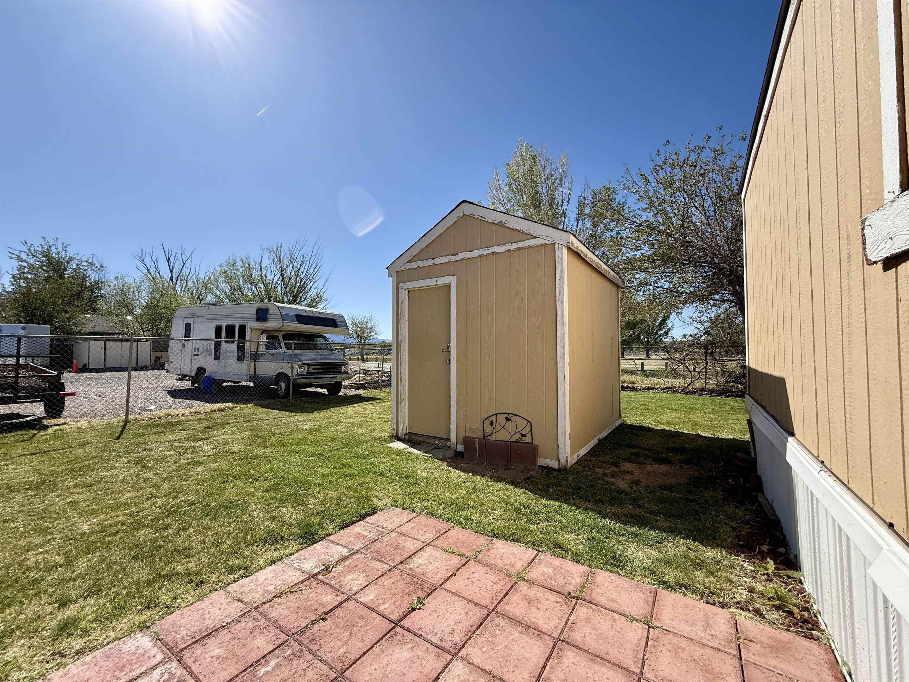 3251 E Road, Unit 33 Clifton, CO 81520 - Photo 23 of 28 a view of a house with backyard and sitting area
