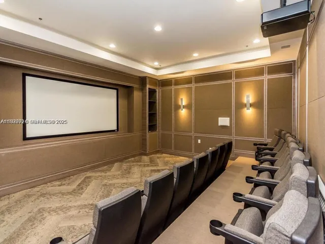 a bathroom with a granite countertop sink a toilet a mirror and vanity