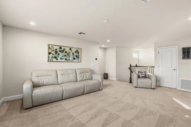 a white couch sitting in a living room and couch