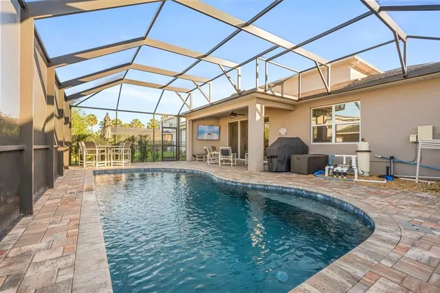 a view of a swimming pool with a patio