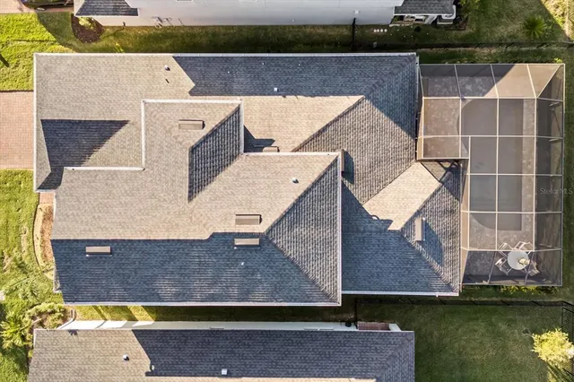an aerial view of a house with a ocean view