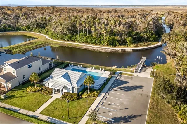 an aerial view of a house with swimming pool