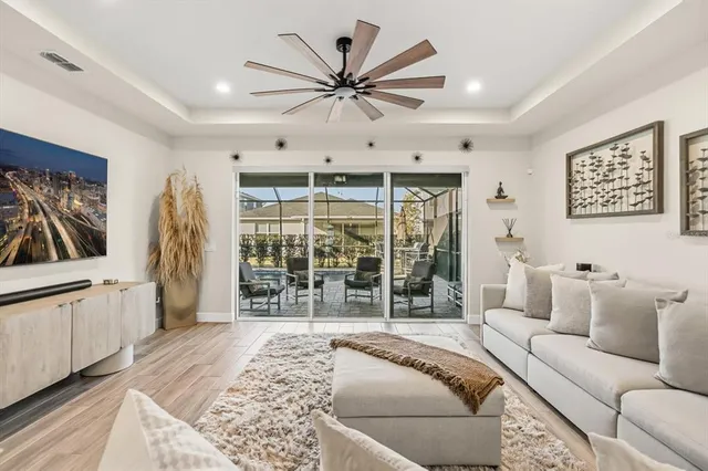 a living room with furniture and a large window