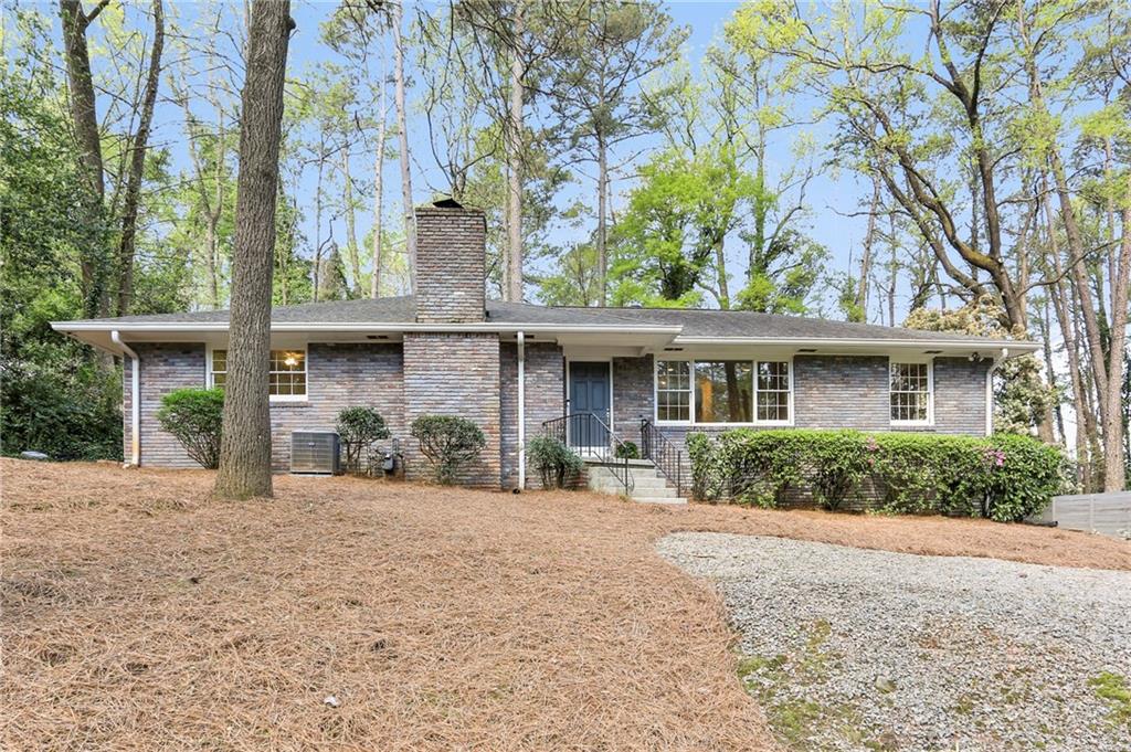 2056 Lenox Road Northeast Atlanta, GA 30324 - Photo 1 of 1 a front view of a house with a garden