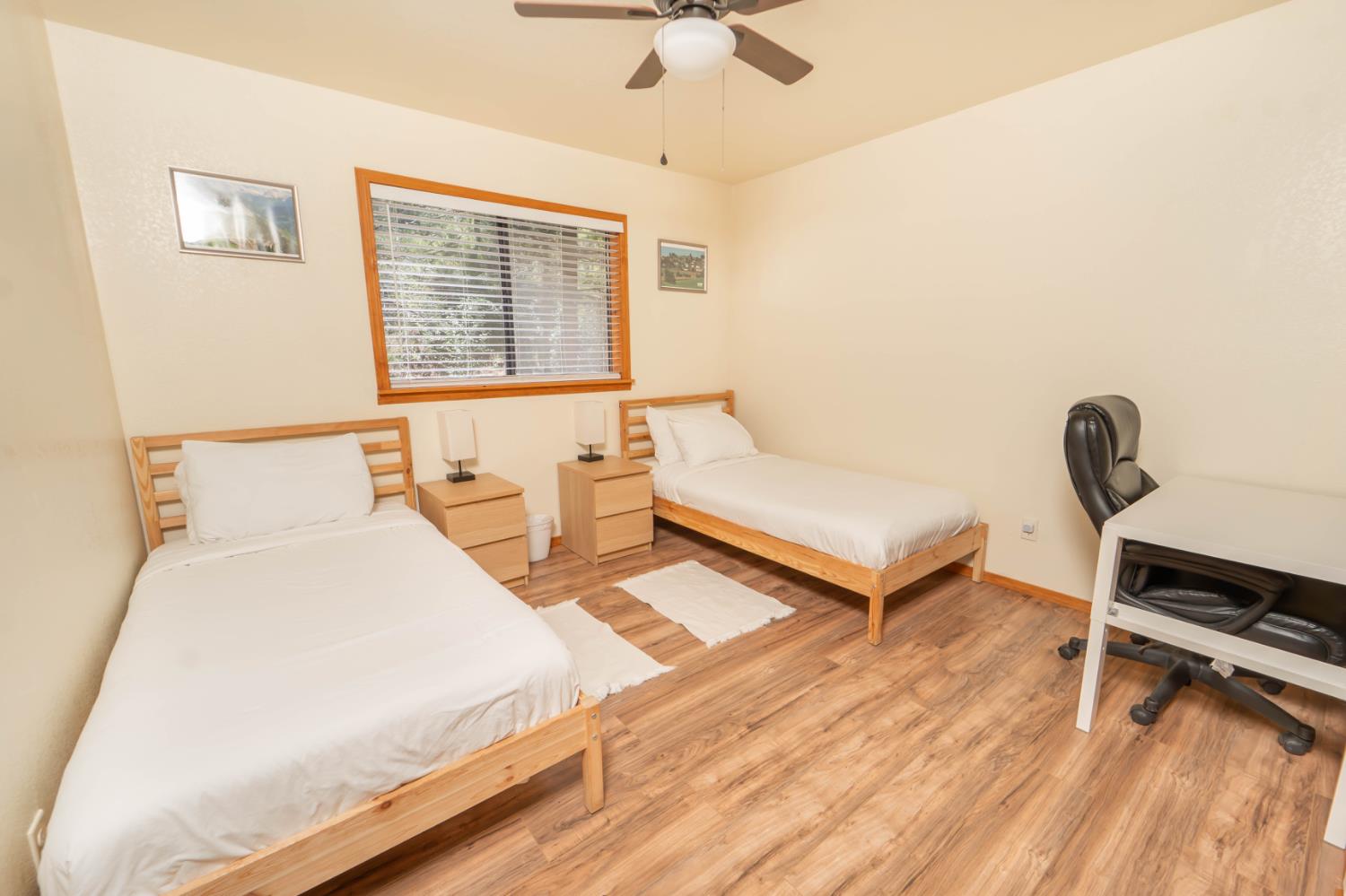 52865 Highway 245 Miramonte, CA 93641 - Photo 16 of 29 a bedroom with a bed and a window