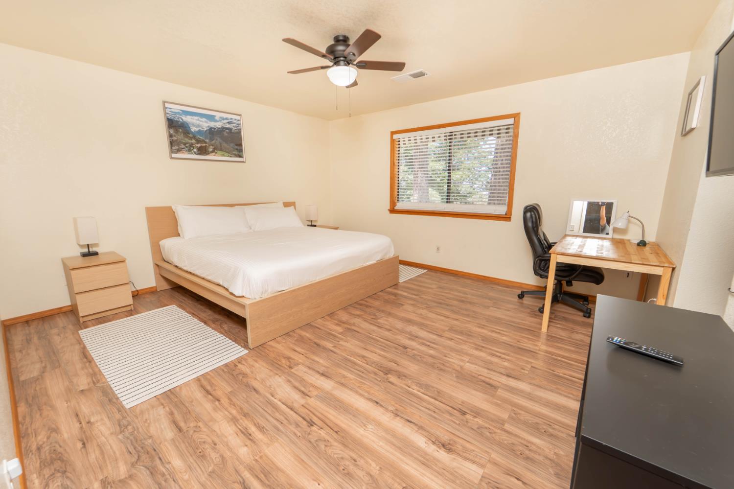 52865 Highway 245 Miramonte, CA 93641 - Photo 17 of 29 a bedroom with a bed and a desk