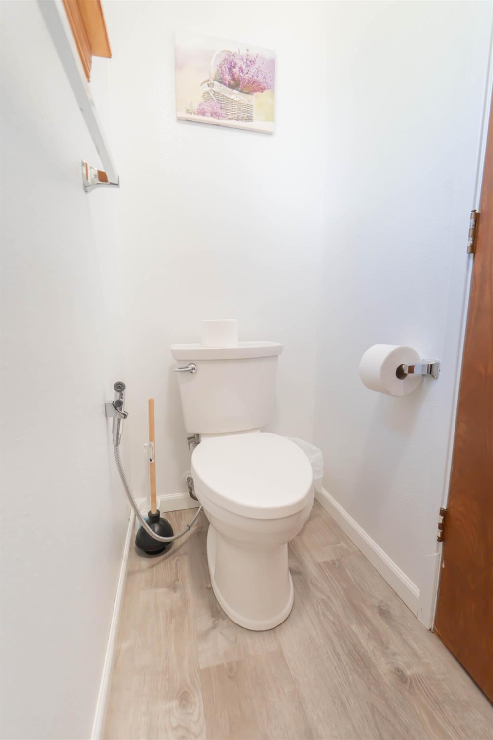 52865 Highway 245 Miramonte, CA 93641 - Photo 20 of 29 a white toilet sitting next to a shower