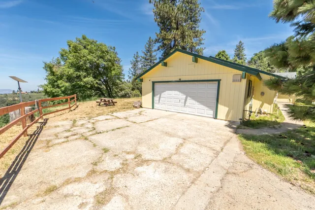 a view of a backyard with sitting area