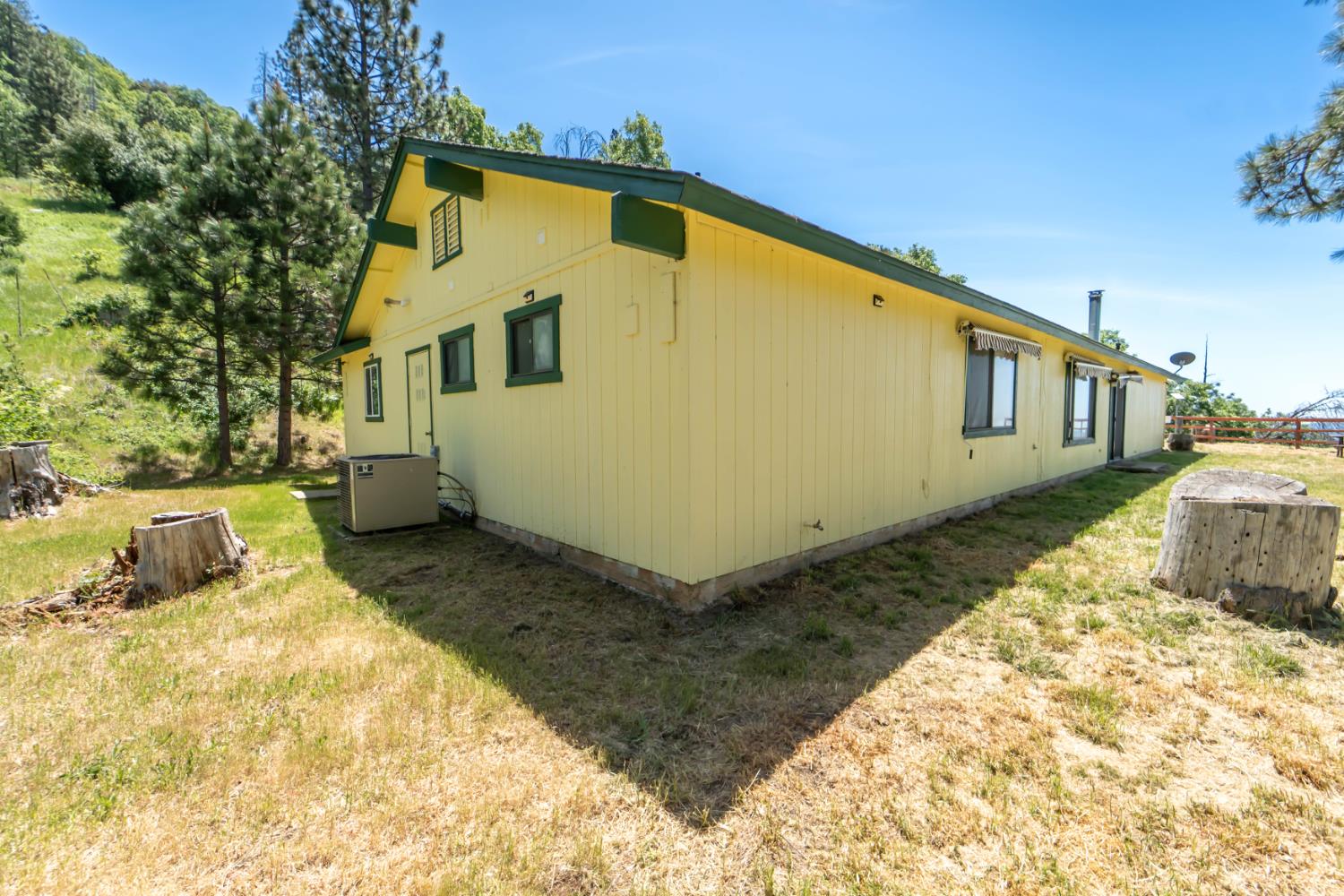 52865 Highway 245 Miramonte, CA 93641 - Photo 25 of 29 a front view of a house with a yard