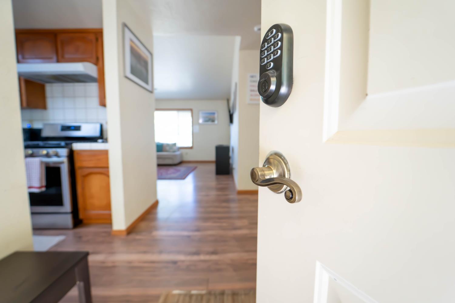 52865 Highway 245 Miramonte, CA 93641 - Photo 4 of 29 a hallway with wooden floor and windows
