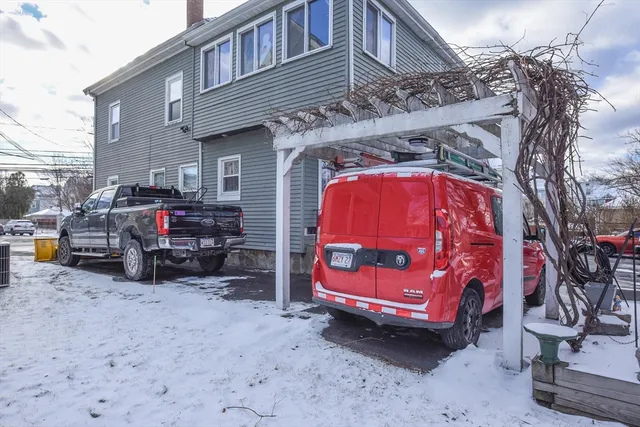 a view of a car park in front of house
