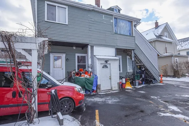 a view of a front of a house with a garage
