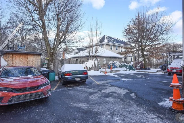 a view of a cars park in front of house