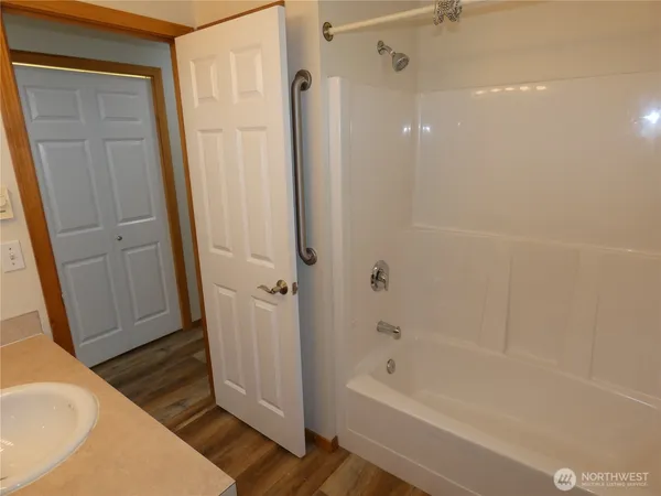 a bathroom with a bathtub and a shower