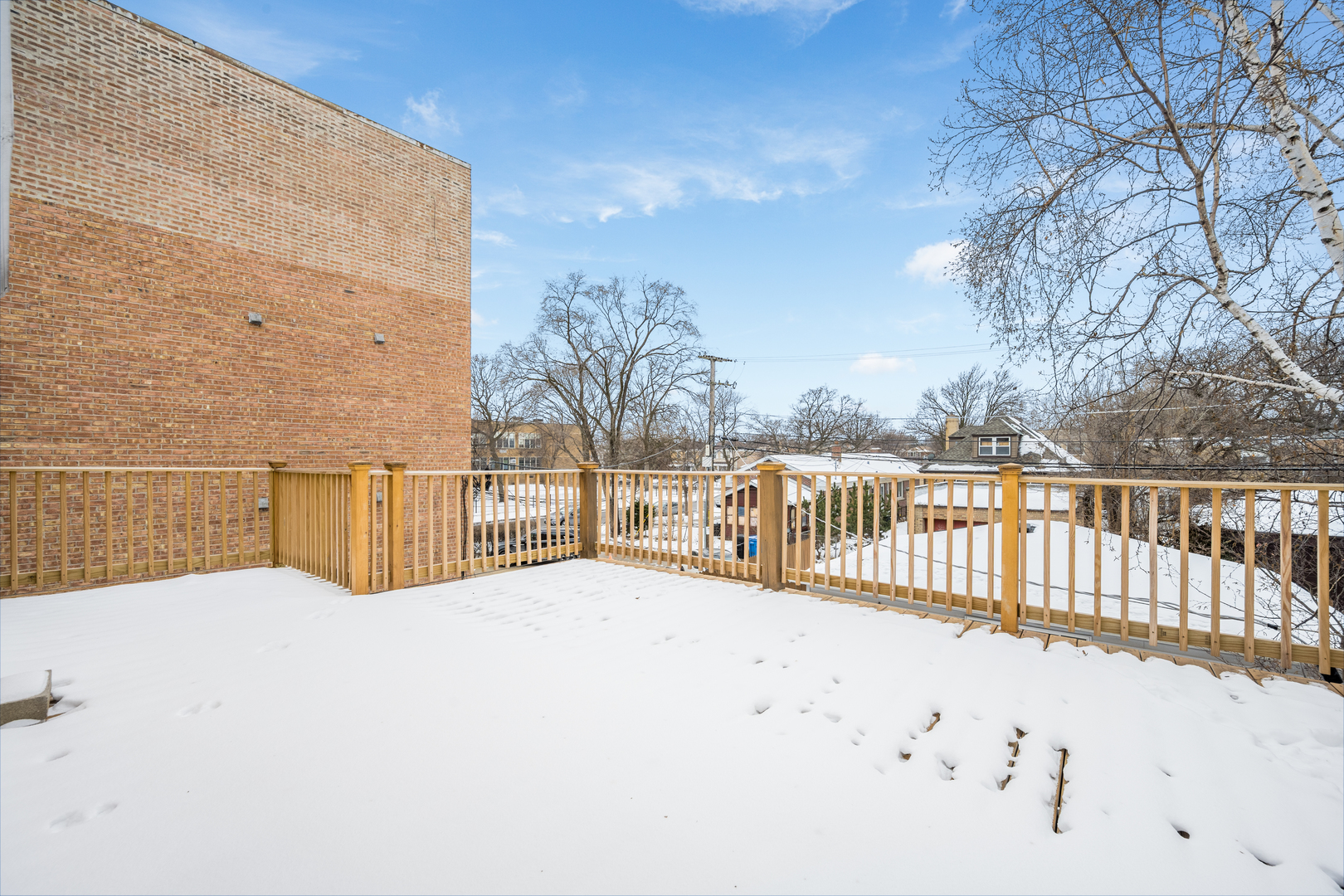 5706 North Mozart Street Chicago, IL 60659 - Photo 13 of 28 a view of terrace with wooden fence