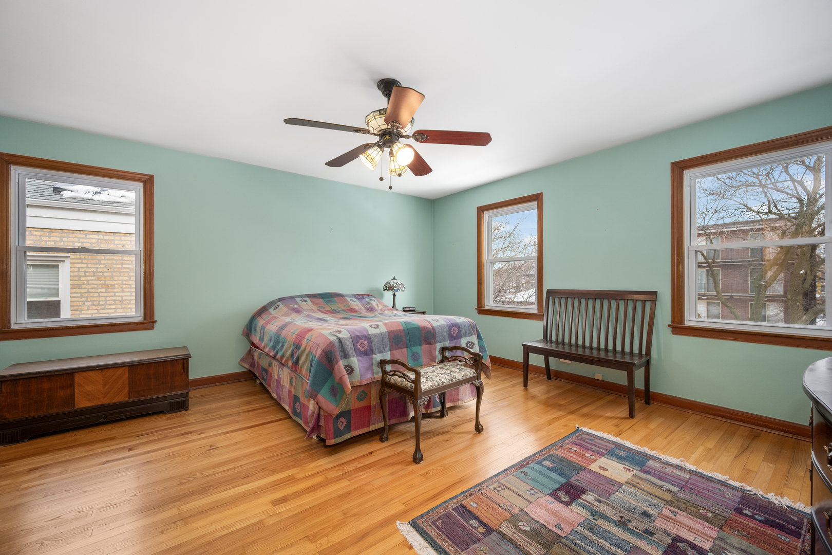 5706 North Mozart Street Chicago, IL 60659 - Photo 16 of 28 a bedroom with a bed wooden floor and window