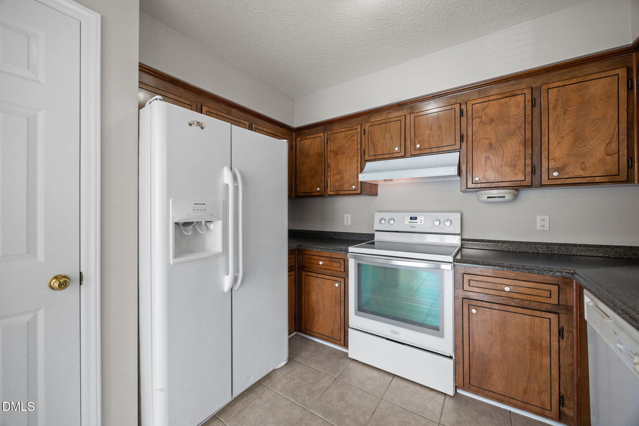40 Circle Tree Lane Angier, NC 27501 - Photo 15 of 39 a kitchen with stainless steel appliances granite countertop a refrigerator and a stove top oven