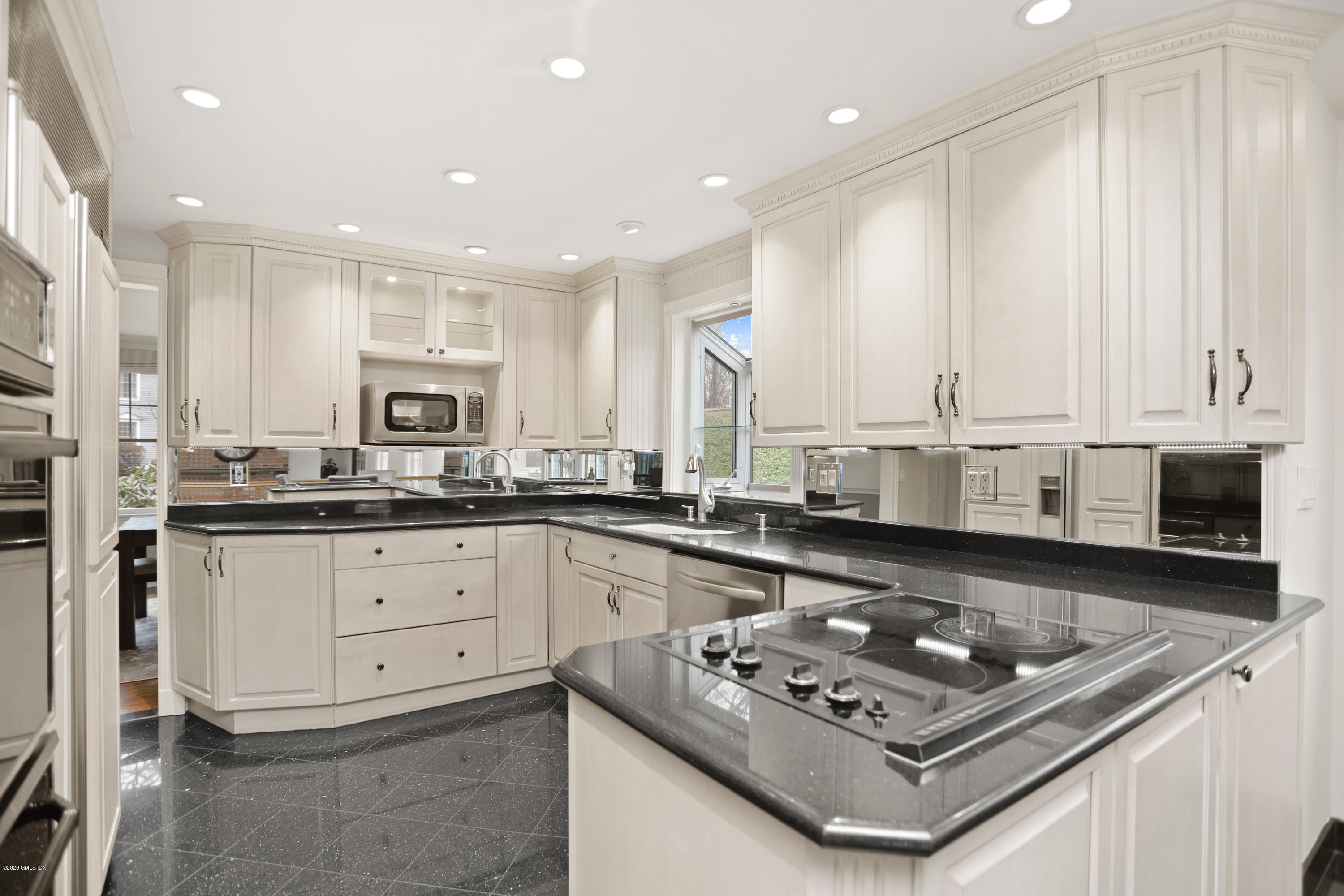 92 North Old Stone Bridge Road Cos Cob, CT 06807 - Photo 14 of 38 a kitchen with stainless steel appliances granite countertop a stove a sink and a microwave