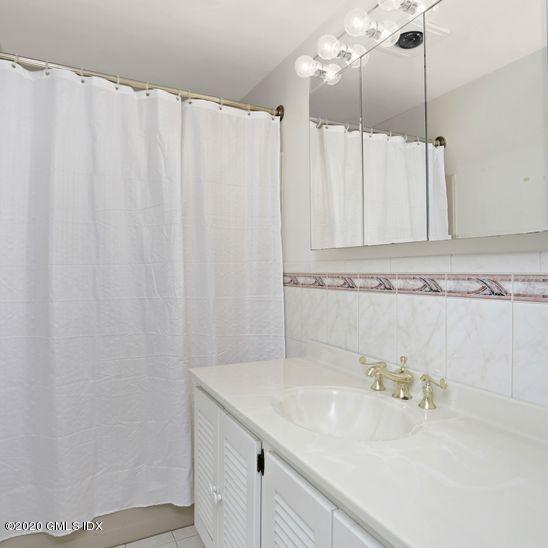 92 North Old Stone Bridge Road Cos Cob, CT 06807 - Photo 24 of 38 a bathroom with a sink and a mirror