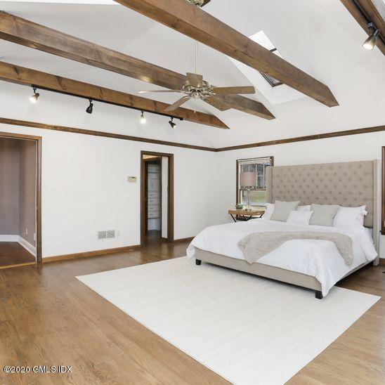 92 North Old Stone Bridge Road Cos Cob, CT 06807 - Photo 26 of 38 a bedroom with a bed and a ceiling fan