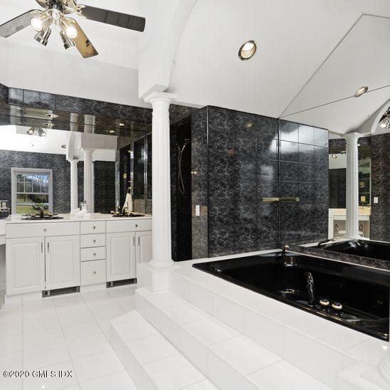 92 North Old Stone Bridge Road Cos Cob, CT 06807 - Photo 28 of 38 a kitchen with stainless steel appliances kitchen island granite countertop a sink and white cabinets