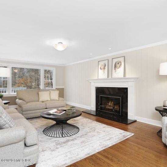 92 North Old Stone Bridge Road Cos Cob, CT 06807 - Photo 3 of 38 a living room with furniture and a fireplace