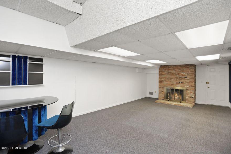 92 North Old Stone Bridge Road Cos Cob, CT 06807 - Photo 31 of 38 a view of an empty room with a fireplace