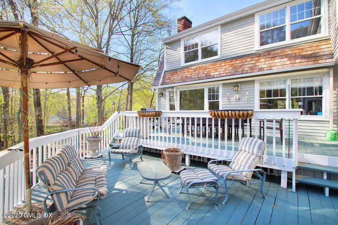 92 North Old Stone Bridge Road Cos Cob, CT 06807 - Photo 32 of 38 a view of a patio with a bench