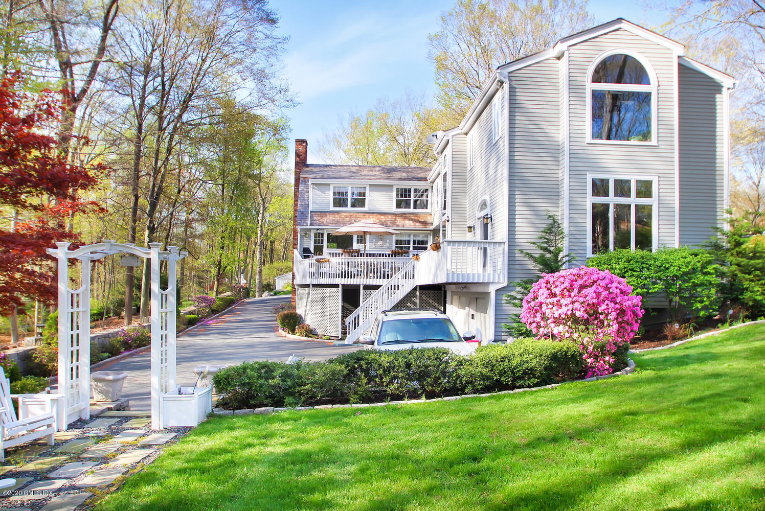92 North Old Stone Bridge Road Cos Cob, CT 06807 - Photo 33 of 38 a front view of a house with garden