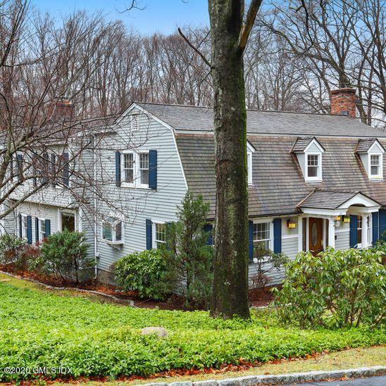 92 North Old Stone Bridge Road Cos Cob, CT 06807 - Photo 34 of 38 a front view of a house with a yard