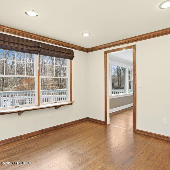92 North Old Stone Bridge Road Cos Cob, CT 06807 - Photo 7 of 38 a view of a room with wooden floor and windows