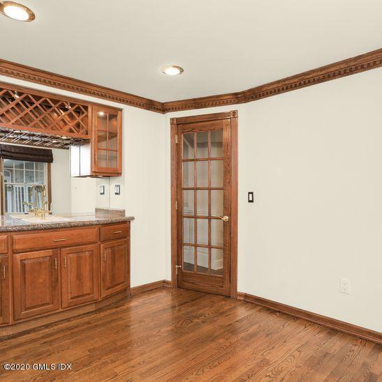 92 North Old Stone Bridge Road Cos Cob, CT 06807 - Photo 8 of 38 a view of an empty room with window and wooden floor