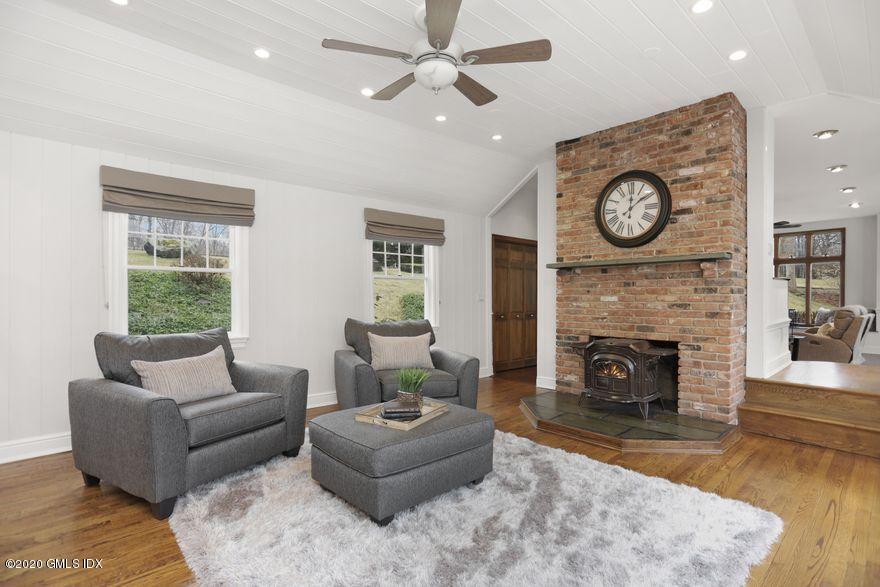 92 North Old Stone Bridge Road Cos Cob, CT 06807 - Photo 9 of 38 a living room with furniture and a fireplace