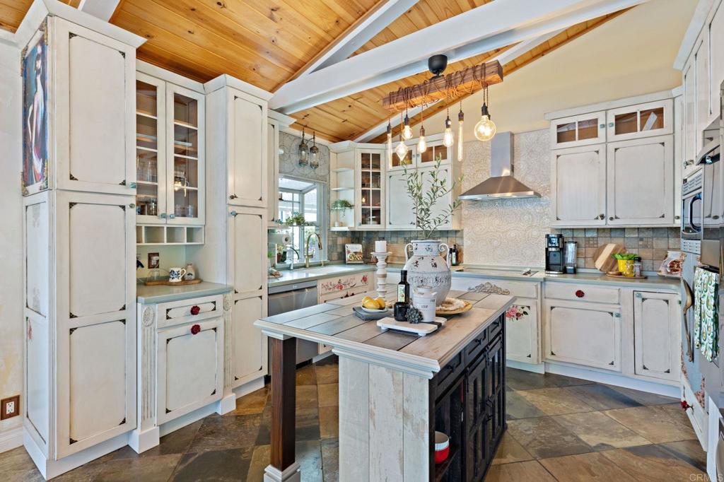 2042 Pheasant Run Road Fallbrook, CA 92028 - Photo 17 of 75 a kitchen that has a lot of cabinets in it