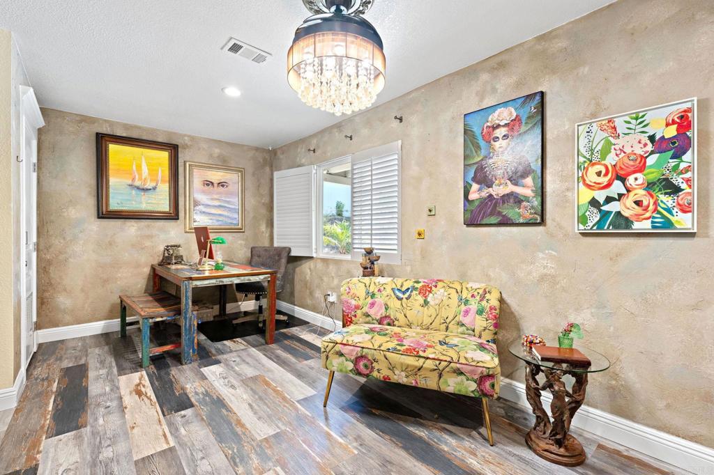 2042 Pheasant Run Road Fallbrook, CA 92028 - Photo 21 of 75 a bedroom with a bed and a chandelier