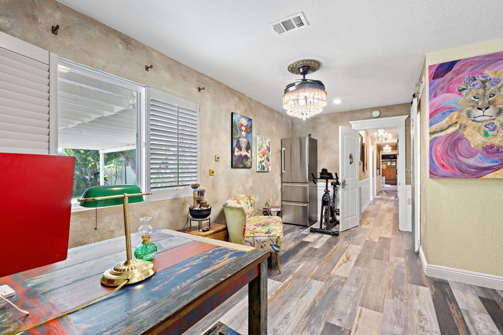 2042 Pheasant Run Road Fallbrook, CA 92028 - Photo 22 of 75 a living room with dining table furniture and wooden floor