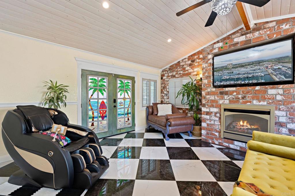 2042 Pheasant Run Road Fallbrook, CA 92028 - Photo 32 of 75 a living room with furniture and a fireplace
