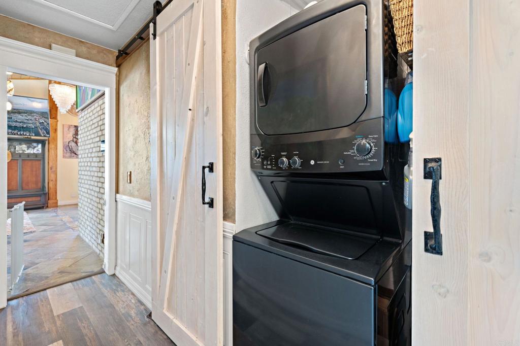 2042 Pheasant Run Road Fallbrook, CA 92028 - Photo 36 of 75 a living room with a fireplace and a mirror