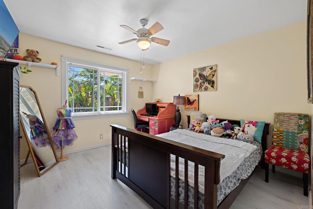 2042 Pheasant Run Road Fallbrook, CA 92028 - Photo 37 of 75 a bedroom with furniture baby crib and a window