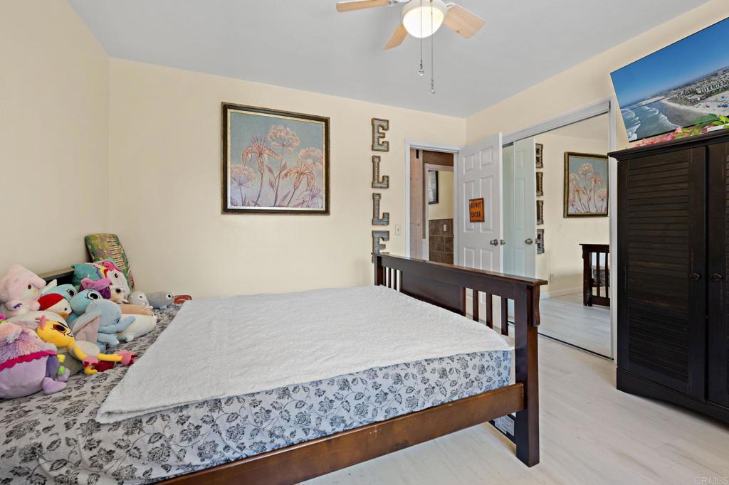 2042 Pheasant Run Road Fallbrook, CA 92028 - Photo 38 of 75 a bedroom with a bed and wooden floor